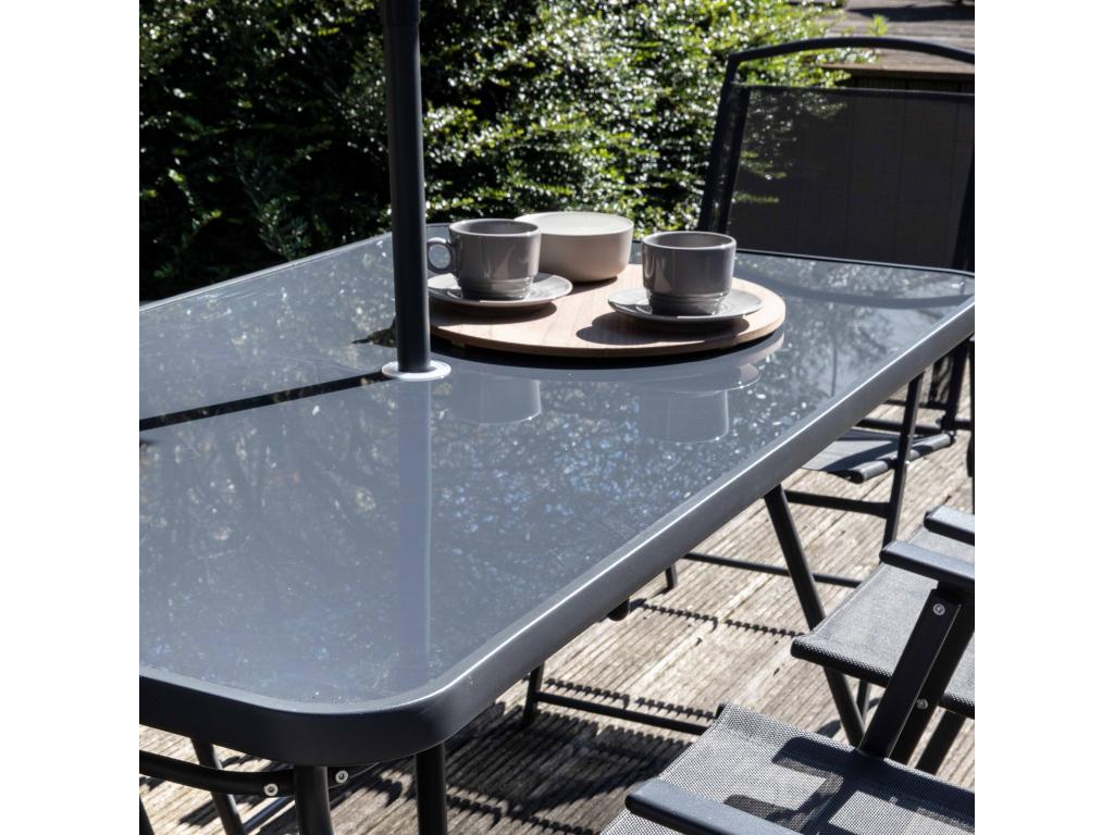 Garden furniture set with table and 6 folding chairs with central parasol